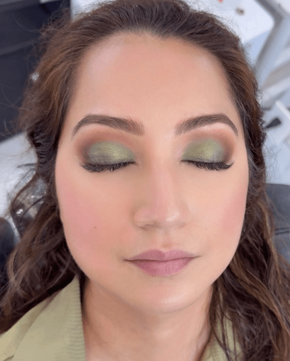 Green and gold eye makeup with smoky blend